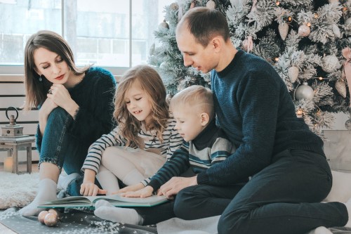 trustage life insurance from america's credit union can protect your family - family in front of christmas tree